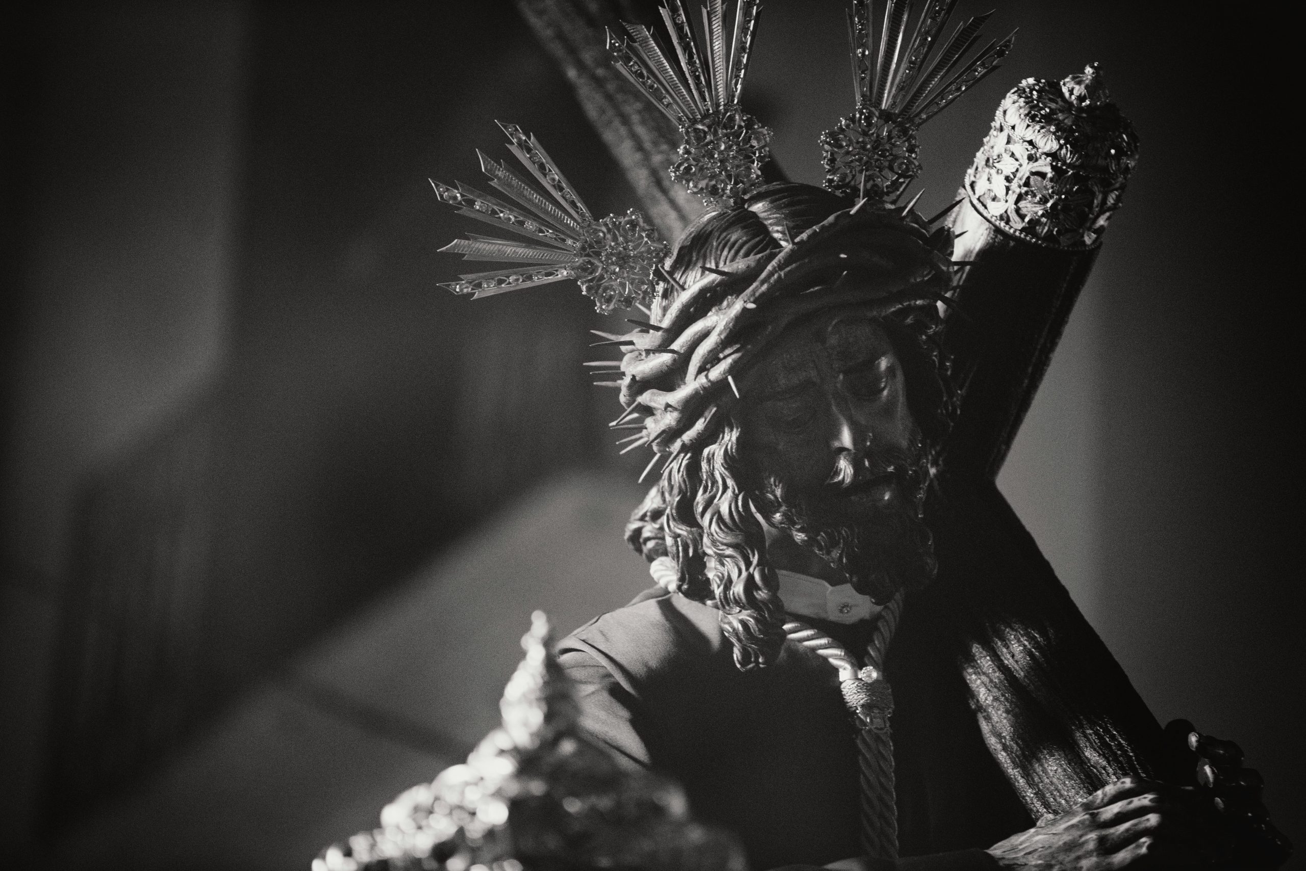 Statue of Jesus carrying the cross in a Catholic church, featured in Apostle Times.