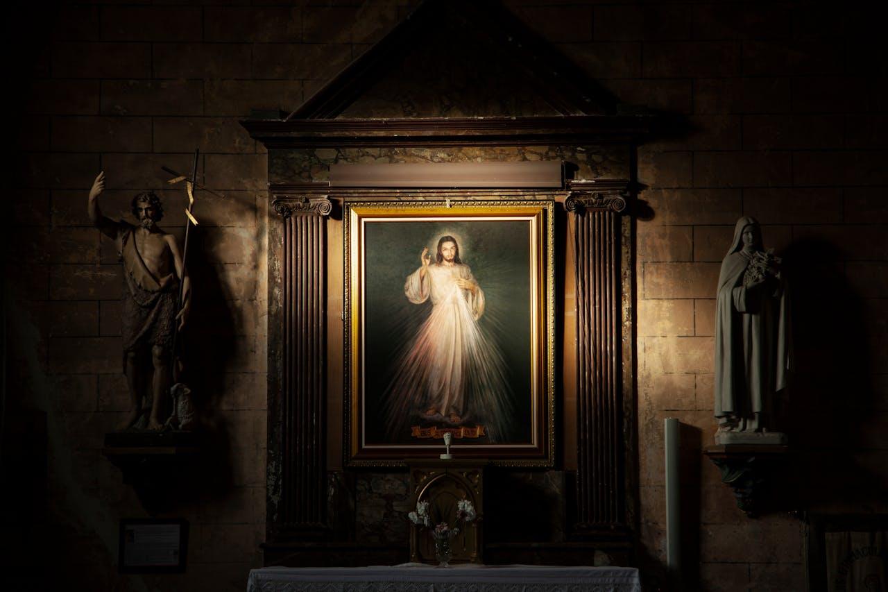 Divine mercy painting hanging inside a Catholic church, featured in Catholic news blog Apostle Times.