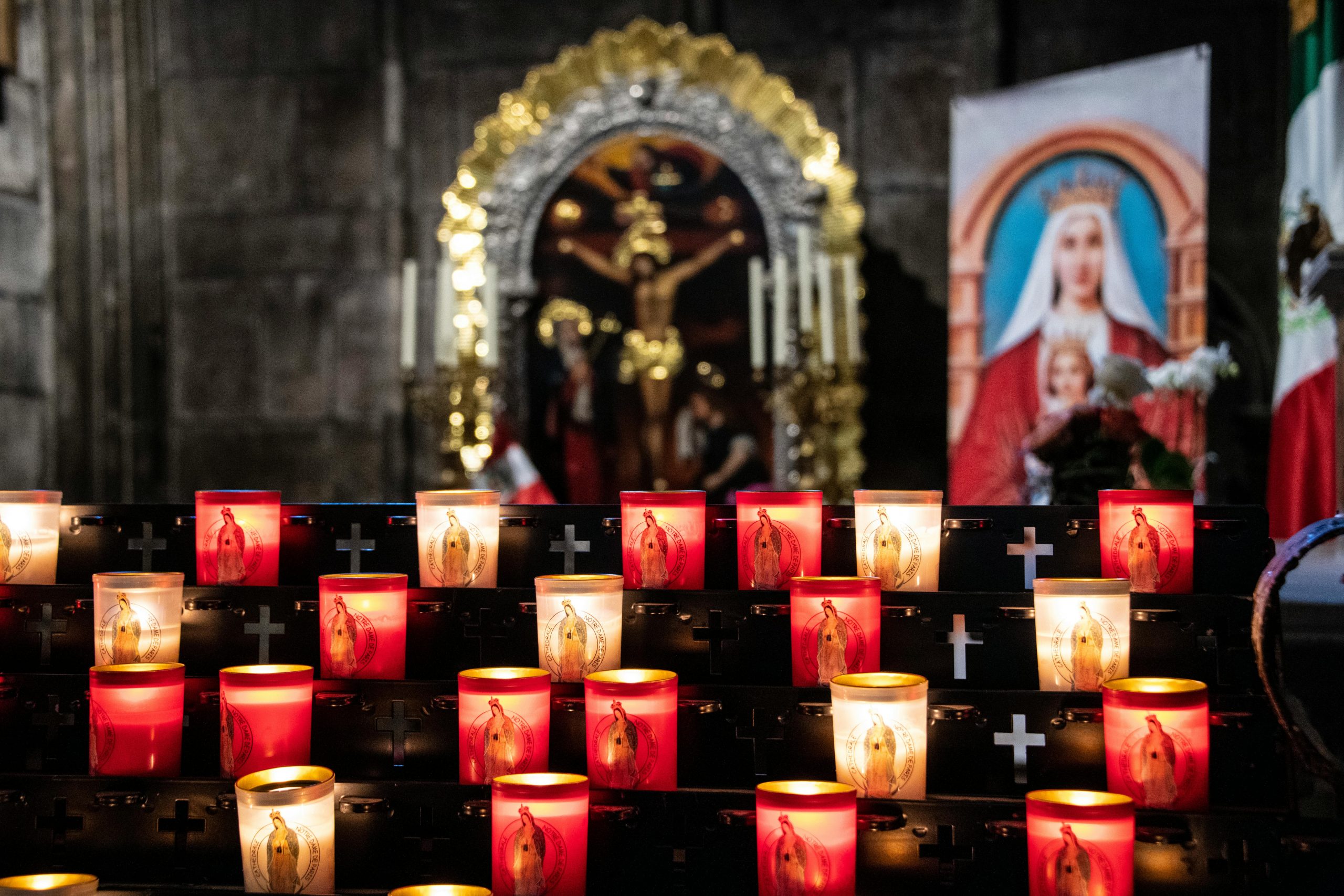 Candles at a Catholic shrine, featured in Catholic news blog Apostle Times.